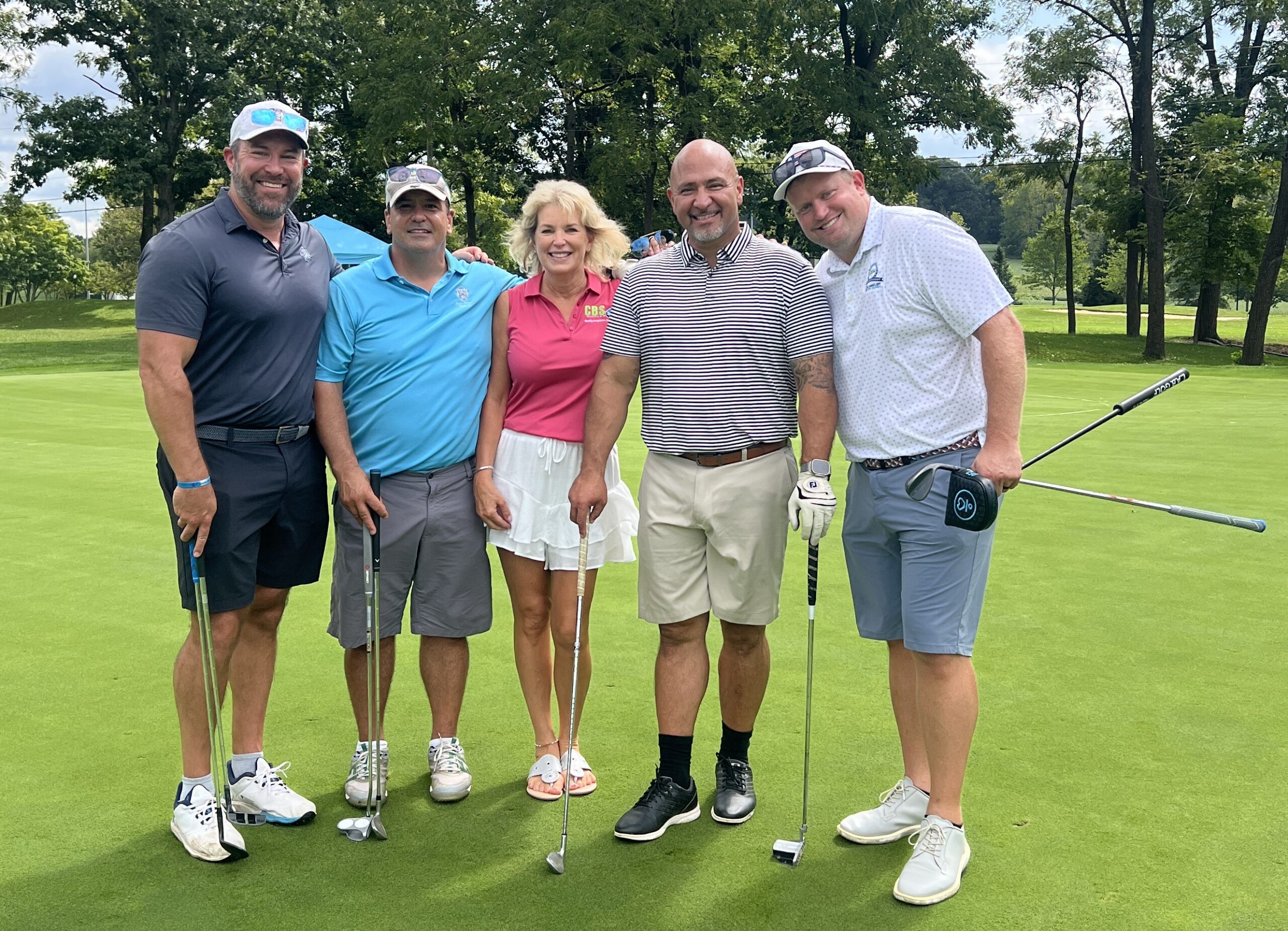 golfers posing for a picture