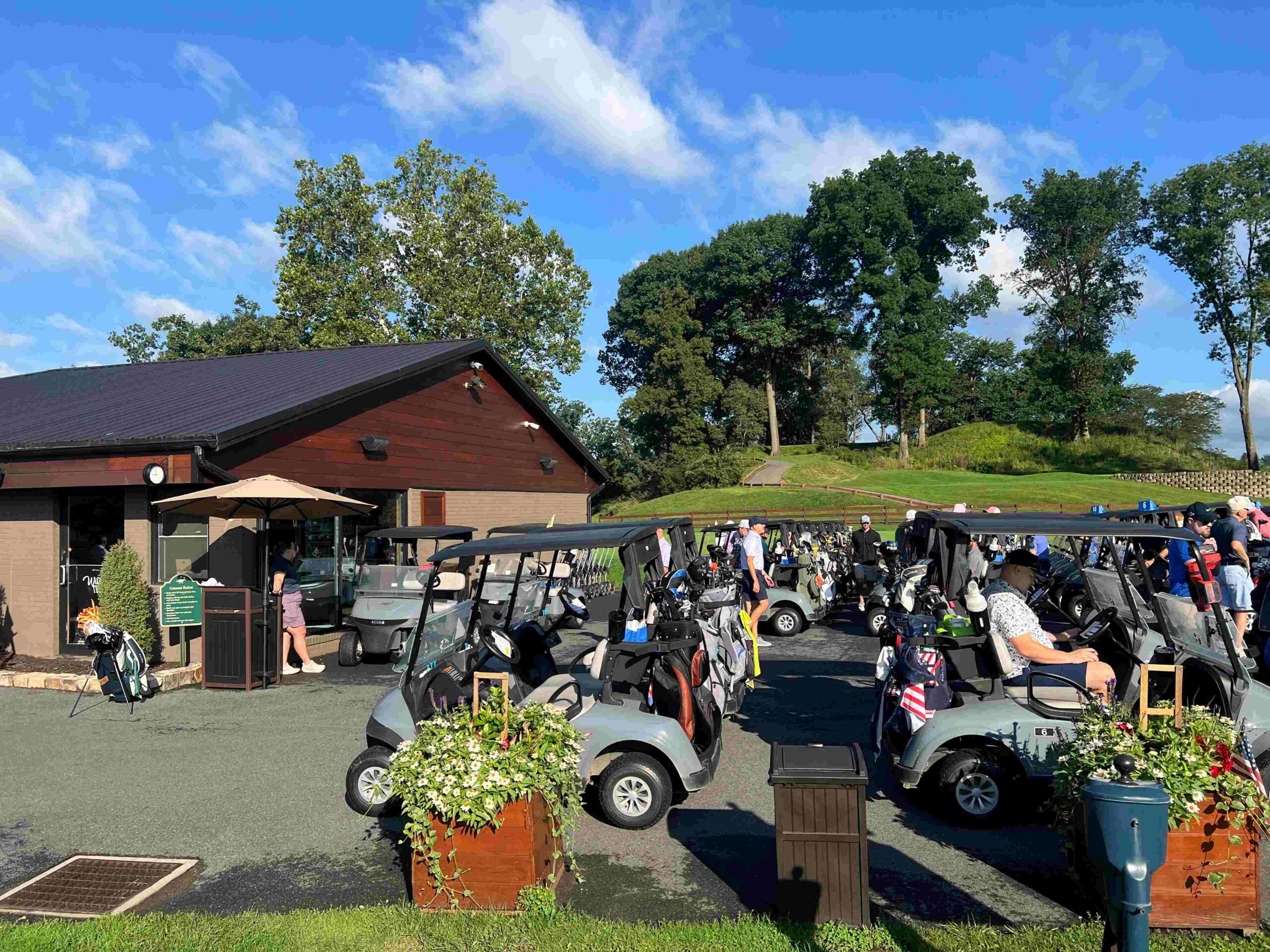 Golf carts assembling at a golf course